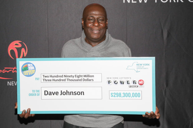 David Johnson from New York with his Powerball jackpot check